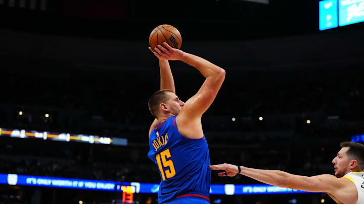 Denver Nuggets center Nikola Jokic (15) shoots the ball in the third quarter against the Utah Jazz at Ball Arena. 