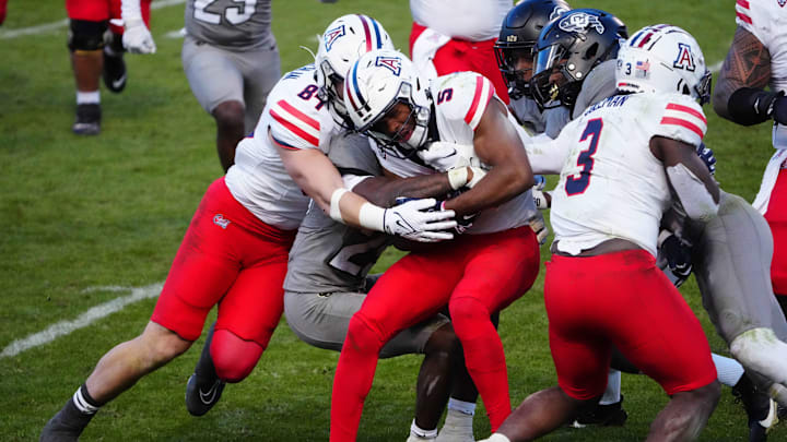 Nov 11, 2023; Boulder, Colorado, USA; Arizona Wildcats wide receiver Montana Lemonious-Craig (5) carries the ball in the fourth quarter against the Colorado Buffaloes at Folsom Field. Mandatory Credit: Ron Chenoy-Imagn Images