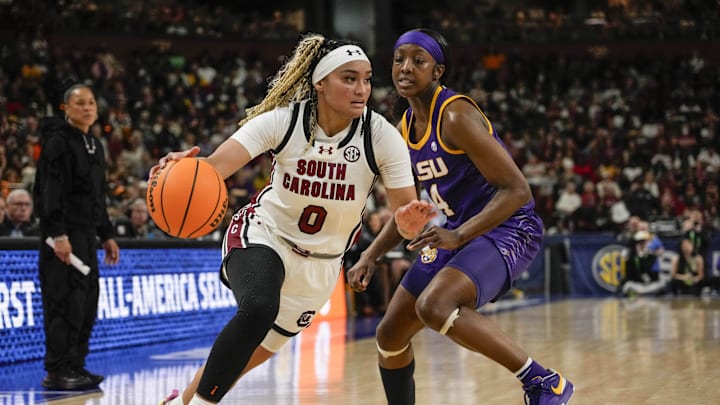 South Carolina basketball guard Te-Hina Paopao blowing by Flau'jae Johnson