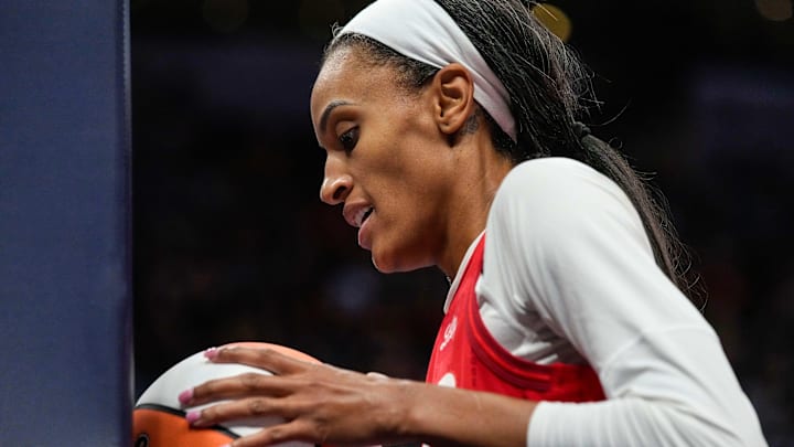 May 30, 2025; Indianapolis, Indiana, USA; Indiana Fever forward DeWanna Bonner (25) presses the ball against the goal in frustration after missing a shot Friday, May 30, 2025, during the game at Gainbridge Fieldhouse in Indianapolis. Mandatory Credit: Grace Hollars-USA TODAY Network via Imagn Images