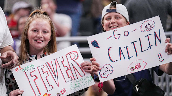May 9, 2024; Indianapolis, IN, USA; Indiana Fever fans hold up signs for Indiana Fever guard Caitlin Clark (22) on Thursday, May 9, 2024, ahead of the preseason game against the Atlanta Dream at Gainbridge Fieldhouse in Indianapolis.