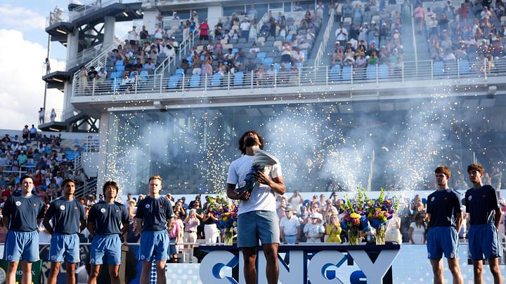 Aug 23, 2026; Cincinnati, OH, USA; Arthur Fils (FRA) celebrates with the Rookwood Cup after defeating Frances Tiafoe (USA) during the finals of the Cincinnati Open at Lindner Family Tennis Center. Mandatory Credit: Aaron Doster-Imagn Images Aug 23, 2026; Cincinnati, OH, USA; Arthur Fils (FRA) celebrates with the Rookwood Cup after defeating Frances Tiafoe (USA) during the finals of the Cincinnati Open at Lindner Family Tennis Center. Mandatory Credit: Aaron Doster-Imagn Images