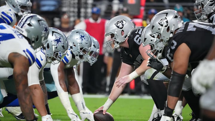 Nov 17, 2025; Paradise, Nevada, USA; A general view of the line of scrimmage as Las Vegas Raiders center Will Putnam (67) prepares to snap the ball against the Dallas Cowboys during the second half at Allegiant Stadium. Mandatory Credit: Kirby Lee-Imagn Images Nov 17, 2025; Paradise, Nevada, USA; A general view of the line of scrimmage as Las Vegas Raiders center Will Putnam (67) prepares to snap the ball against the Dallas Cowboys during the second half at Allegiant Stadium. Mandatory Credit: Kirby Lee-Imagn Images