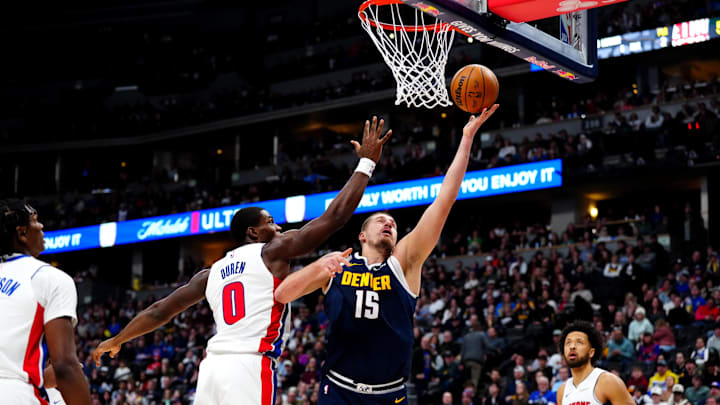Detroit Pistons center Jalen Duren (0) defends on Denver Nuggets center Nikola Jokic (15) in the second quarter at Ball Arena. Mandatory Credit: Ron Chenoy-Imagn Images Detroit Pistons center Jalen Duren (0) defends on Denver Nuggets center Nikola Jokic (15) in the second quarter at Ball Arena. Mandatory Credit: Ron Chenoy-Imagn Images