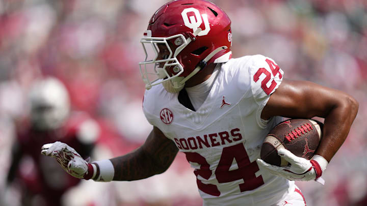 Oklahoma running back Xavier Robinson carries the ball against Temple.