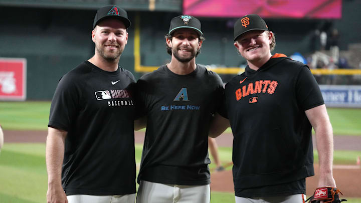 Sep 17, 2025; Phoenix, Arizona, USA; Arizona Diamondbacks pitchers Corbin Burnes, Zac Gallen, and San Francisco Giants pitcher Logan Webb pose for an image before a game at Chase Field. Mandatory Credit: Rick Scuteri-Imagn Images Sep 17, 2025; Phoenix, Arizona, USA; Arizona Diamondbacks pitchers Corbin Burnes, Zac Gallen, and San Francisco Giants pitcher Logan Webb pose for an image before a game at Chase Field. Mandatory Credit: Rick Scuteri-Imagn Images