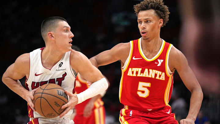 Oct 16, 2024; Miami, Florida, USA;  Atlanta Hawks guard Dyson Daniels (5) defends Miami Heat guard Tyler Herro (14) in the first half at Kaseya Center. Mandatory Credit: Jim Rassol-Imagn Images