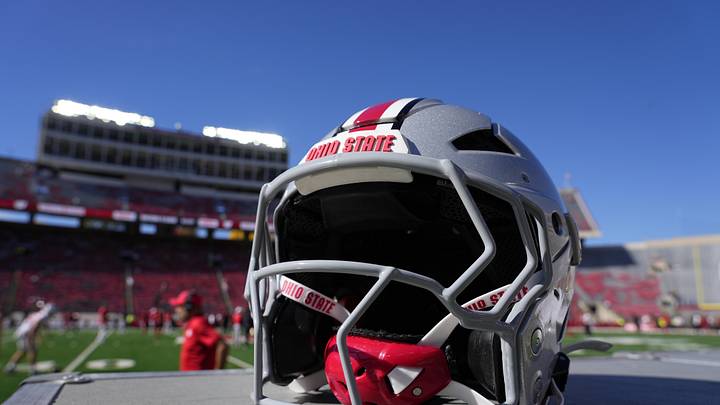 Oct 18, 2025; Madison, Wisconsin, USA; Detail view of an Ohio State Buckeyes helmet before the game against the Wisconsin Badgers at Camp Randall Stadium. Mandatory Credit: Jeff Hanisch-Imagn Images Oct 18, 2025; Madison, Wisconsin, USA; Detail view of an Ohio State Buckeyes helmet before the game against the Wisconsin Badgers at Camp Randall Stadium. Mandatory Credit: Jeff Hanisch-Imagn Images
