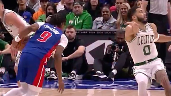Tatum attempting to defend the Pistons' Ausar Thompson. 