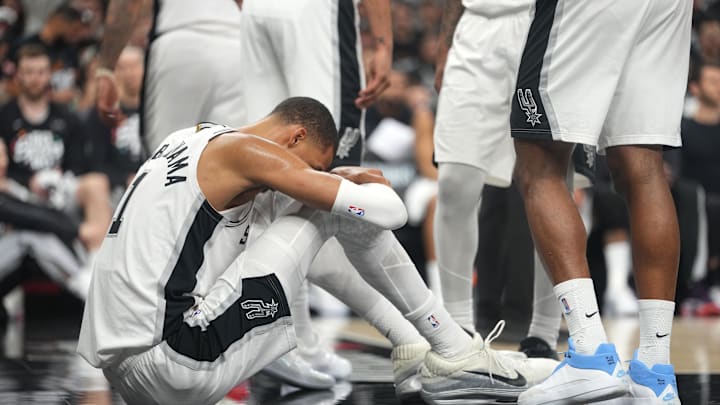 Apr 21, 2026; San Antonio, Texas, USA; San Antonio Spurs forward Victor Wembanyama (1) reacts after falling to the ground during the first half of game two of the first round of the 2026 NBA Playoffs against the Portland Trail Blazers at Frost Bank Center. Mandatory Credit: Scott Wachter-Imagn Images