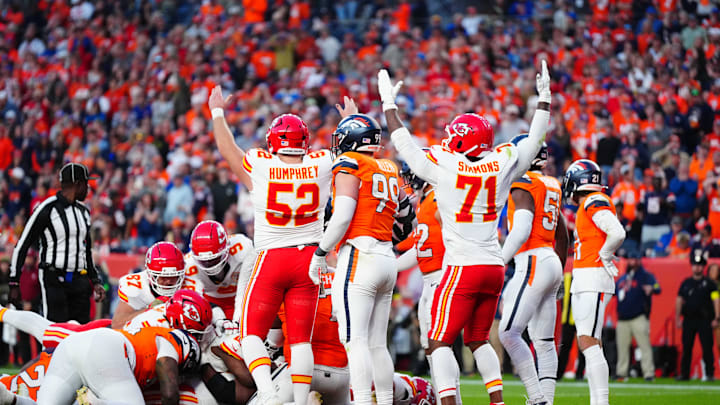 Nov 16, 2025; Denver, Colorado, USA; Kansas City Chiefs center Creed Humphrey (52) and offensive tackle Josh Simmons (71) celebrate a touchdown carry by running back Kareem Hunt (29) (center) in the third quarter against the Denver Broncos at Empower Field at Mile High. Mandatory Credit: Ron Chenoy-Imagn Images
