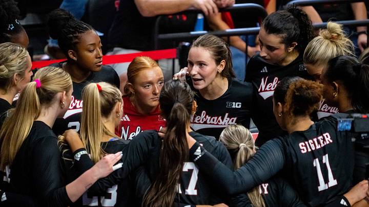 Oct 10, 2026; Lincoln, Nebraska, USA;  Nebraska Cornhuskers setter Bergen Reilly (2) talks with teammates before the third set against the Wisconsin Badgers at Bob Devaney Sport Center.  Mandatory Credit: Dylan Widger-Imagn Images