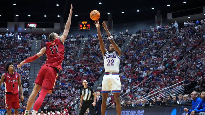 Mar 22, 2026; San Diego, CA, USA; Kansas Jayhawks guard Darryn Peterson (22) shoots against St. John's Red Storm forward Rubén Prey (17) in the second half during a second round game of the men's 2026 NCAA Tournament at Viejas Arena. Mandatory Credit: Kirby Lee-Imagn Images Mar 22, 2026; San Diego, CA, USA; Kansas Jayhawks guard Darryn Peterson (22) shoots against St. John's Red Storm forward Rubén Prey (17) in the second half during a second round game of the men's 2026 NCAA Tournament at Viejas Arena. Mandatory Credit: Kirby Lee-Imagn Images