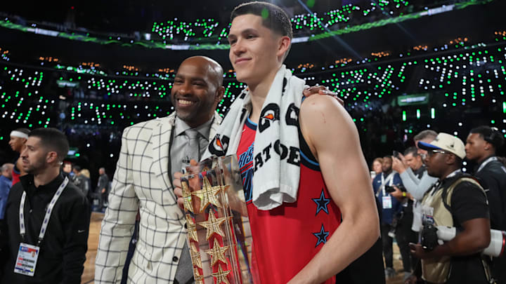 Feb 13, 2026; Inglewood, California, USA; Team Vince guard Egor Demin (8) of the Brooklyn Nets and honorary coach Vince Carter celebrate after defeating Team Melo in an NBA All Star Rising Stars championship game at Intuit Dome. Mandatory Credit: Kirby Lee-Imagn Images