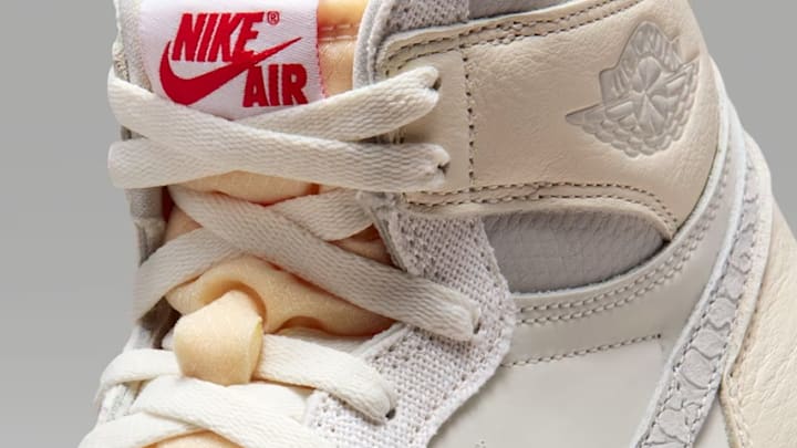 The Air Jordan 1 High OG 'Sail Elephant Print' colorway.