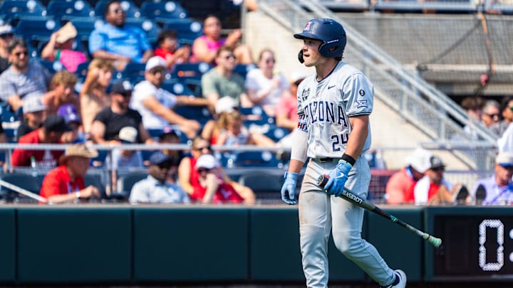 Jun 15, 2025; Omaha, Neb, USA; Arizona Wildcats shortstop Mason White (24) walks off after striking out against the Louisville Cardinals during the ninth inning at Charles Schwab Field. Mandatory Credit: Dylan Widger-Imagn Images