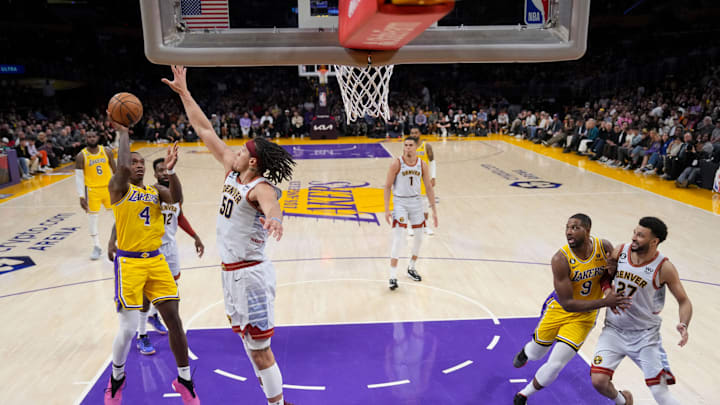 May 22, 2023; Los Angeles, California, USA; Los Angeles Lakers guard Lonnie Walker IV (4) shoots the ball against Denver Nuggets forward Aaron Gordon (50) in game four of the Western Conference Finals for the 2023 NBA playoffs at Crypto.com Arena. Mandatory Credit: Kirby Lee-Imagn Images