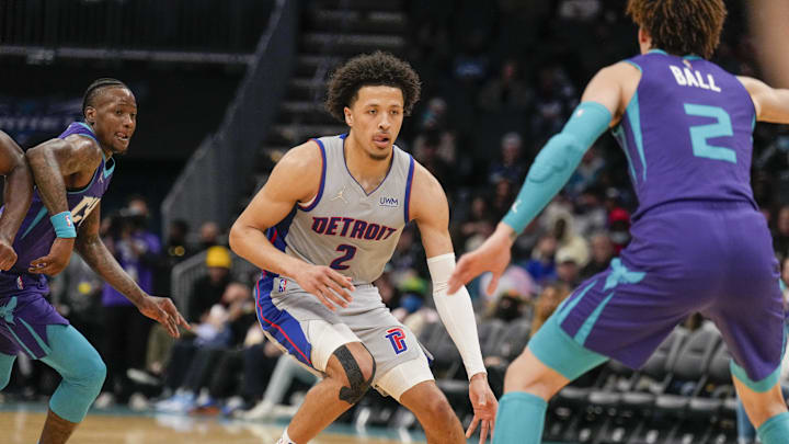 Feb 27, 2022; Charlotte, North Carolina, USA; Detroit Pistons guard Cade Cunningham (2) dribbles against Charlotte Hornets guard LaMelo Ball (2) during the second half at the Spectrum Center. Mandatory Credit: Jim Dedmon-Imagn Imagesthe