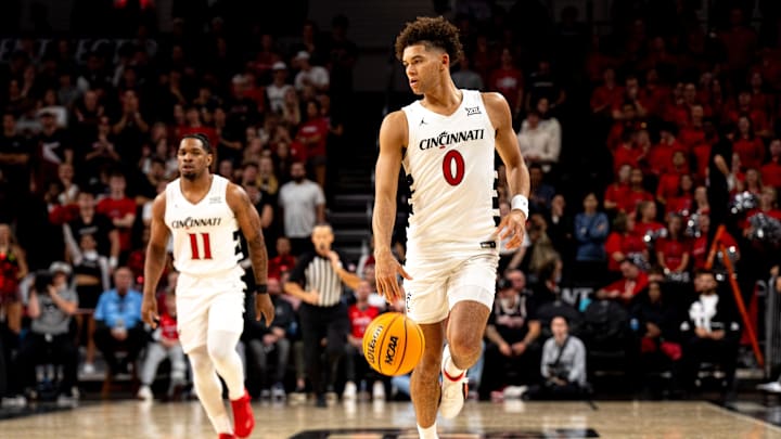 Cincinnati Bearcats guard Dan Skillings Jr. (0) dribbles the ball in the second half of a basketball scrimmage between Cincinnati Bearcats and Ohio State Buckeyes at Fifth Third Arena in Cincinnati on Friday, Oct. 18, 2024. Cincinnati Bearcats guard Dan Skillings Jr. (0) dribbles the ball in the second half of a basketball scrimmage between Cincinnati Bearcats and Ohio State Buckeyes at Fifth Third Arena in Cincinnati on Friday, Oct. 18, 2024.