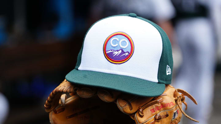 Jun 10, 2023; Denver, Colorado, USA; General view of the cap and glove of Colorado Rockies second