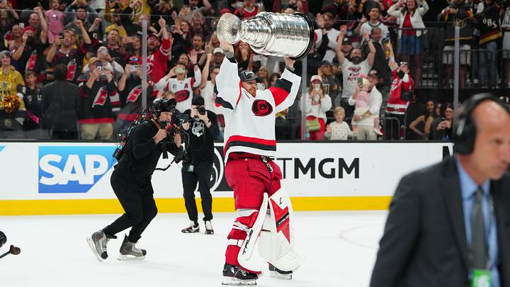 Jun 14, 2026; Las Vegas, Nevada, USA; Carolina Hurricanes goaltender Frederik Andersen (31) raises the the Stanley Cup after defeating the Vegas Golden Knights in game six of the 2026 Stanley Cup Final at T-Mobile Arena. Mandatory Credit: Stephen R. Sylvanie-Imagn Images
