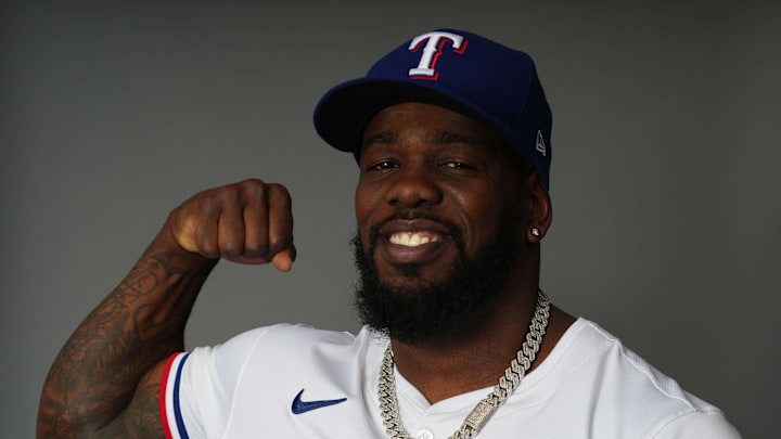 Feb 20, 2024; Surprise, AZ, USA; Texas Rangers right fielder Adolis Garcia (53) poses for a photo