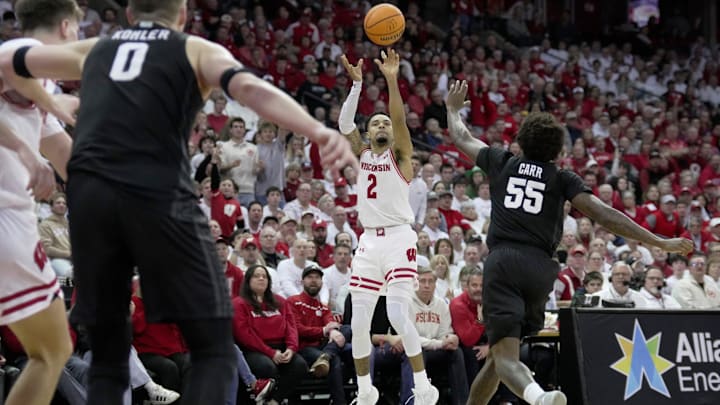 Wisconsin guard Nick Boyd (2) hits a three-point basket during the second half of their game Friday, February 13, 2026 at the Kohl Center in Madison, Wisconsin. Wisconsin beat 10th ranked Michigan State 92-71.