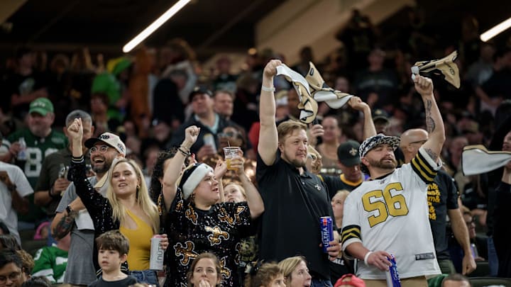 New Orleans Saints fans celebrate a touchdown 