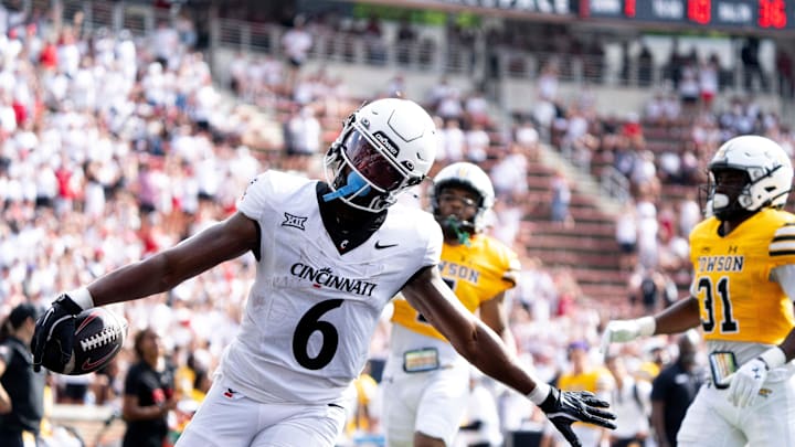 Cincinnati Bearcats running back Evan Pryor (6) gestures a she scores a touchdown in the third quarter of the College Football game between the Cincinnati Bearcats and the Towson Tigers at Nippert Stadium in Cincinnati on Saturday, Aug. 31, 2024.