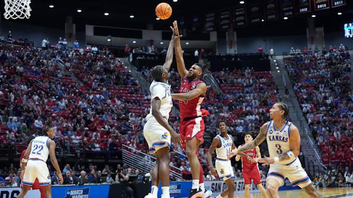 Mar 22, 2026; San Diego, CA, USA; St. John's Red Storm forward Zuby Ejiofor (24) shoots against Kansas Jayhawks forward Flory Bidunga (40) in the first half during a second round game of the men's 2026 NCAA Tournament at Viejas Arena. Mandatory Credit: Kirby Lee-Imagn Images Mar 22, 2026; San Diego, CA, USA; St. John's Red Storm forward Zuby Ejiofor (24) shoots against Kansas Jayhawks forward Flory Bidunga (40) in the first half during a second round game of the men's 2026 NCAA Tournament at Viejas Arena. Mandatory Credit: Kirby Lee-Imagn Images