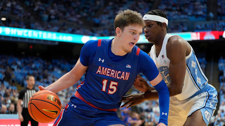 Nov 15, 2024; Chapel Hill, North Carolina, USA; American University Eagles forward Matt Rogers (15) with the ball as North Carolina Tar Heels forward Ven-Allen Lubin (22) defends in the first half at Dean E. Smith Center. Mandatory Credit: Bob Donnan-Imagn Images