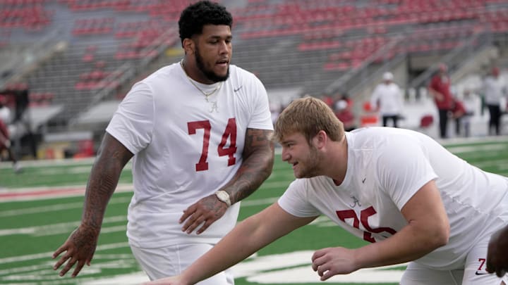 Alabama offensive lineman Kadyn Proctor (74) is shown with offensive lineman Wilkin Formby (75)