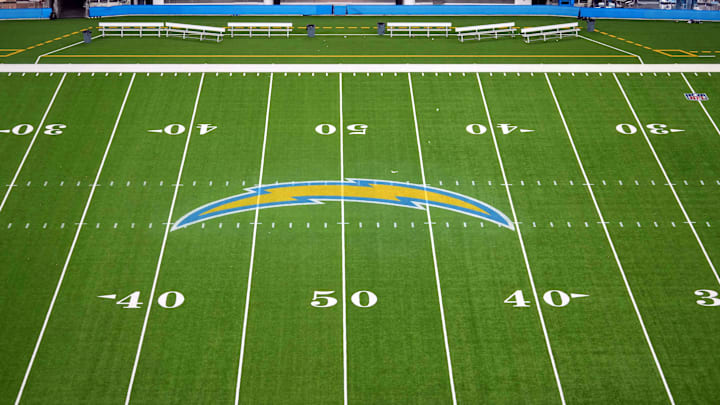Nov 17, 2024; Inglewood, California, USA; The Los Angeles Chargers bolt logo at midfield at SoFi Stadium. Mandatory Credit: Kirby Lee-Imagn Images