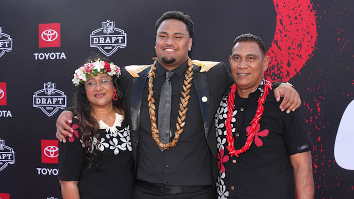 Apr 23, 2026; Pittsburgh, PA, USA; Miami Hurricanes lineman Francis Mauigoa poses with his parents Fa’alialia and Telesia Mauigoa on the red carpet before the 2026 NFL Draft at Point State Park. Mandatory Credit: Kirby Lee-Imagn Images