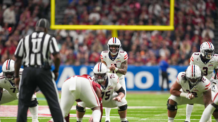 Dec 28, 2023; San Antonio, TX, USA;  Arizona Wildcats quarterback Noah Fifita (11) gets ready to take a snap in the first half against the Oklahoma Sooners at Alamodome. Mandatory Credit: Daniel Dunn-Imagn Images