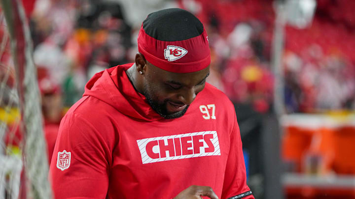 Nov 4, 2024; Kansas City, Missouri, USA; Kansas City Chiefs defensive end Felix Anudike-Uzomah (97) looks at his phone during warm ups against  the Tampa Bay Buccaneers prior to a game at GEHA Field at Arrowhead Stadium. Mandatory Credit: Denny Medley-Imagn Images