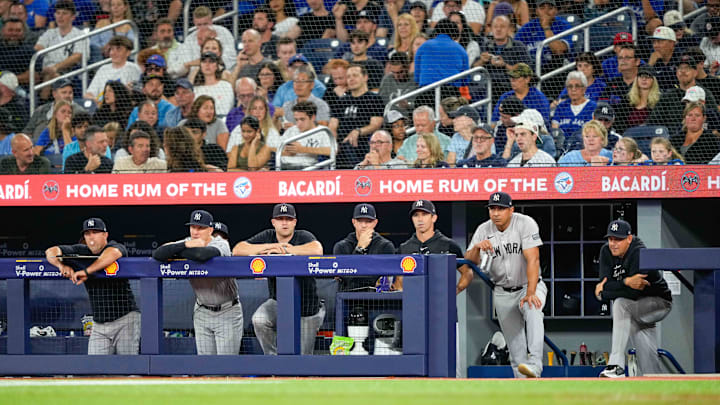 Jun 29, 2024; Toronto, Ontario, CAN; New York Yankees manager Aaron Boone watches from the dugout against the Toronto Blue Jays at Rogers Centre. Mandatory Credit: Kevin Sousa-USA TODAY Sports