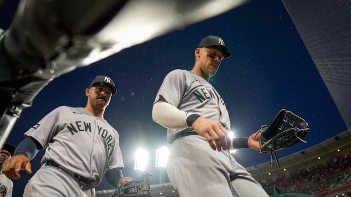 New York Yankees right fielder Aaron Judge (99) and center fielder Trent Grisham (12) return to the dugout after the eighth inning of the MLB interleague game between the Cincinnati Reds and the New York Yankees at Great American Ball Park in downtown Cincinnati on Tuesday, June 24, 2025. The Reds won 5-4 in 11 innings.