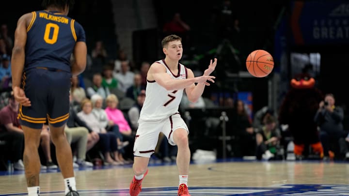 Mar 11, 2025; Charlotte, NC, USA; Virginia Tech Hokies guard Brandon Rechsteiner (7) passes the ball in the first half at Spectrum Center. Mandatory Credit: Bob Donnan-Imagn Images