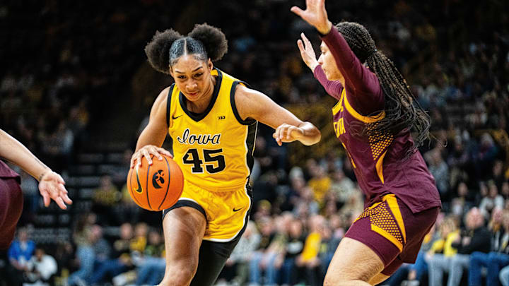 Iowa forward Hannah Stuelke (45) drives to the basket against Minnesota guard Amaya Battle (3) on Feb. 5, 2026, at Carver-Hawkeye Arena. Iowa forward Hannah Stuelke (45) drives to the basket against Minnesota guard Amaya Battle (3) on Feb. 5, 2026, at Carver-Hawkeye Arena.