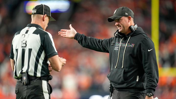 Cincinnati Bengals head coach Zac Taylor talks with a referee in the second quarter of the NFL Week 4 Monday Night Football game between the Denver Broncos and the Cincinnati Bengals at Empower Field at Mile High in Denver on Monday, Sept. 29, 2025.