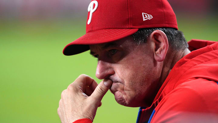 Sep 20, 2025; Phoenix, Arizona, USA; Philadelphia Phillies manager Rob Thomson (49) looks on against the Arizona Diamondbacks during the third inning at Chase Field. Mandatory Credit: Joe Camporeale-Imagn Images