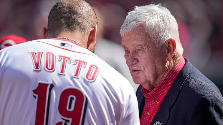 Injured Cincinnati Reds first baseman Joey Votto (19) talks with team owner Bob Castellini