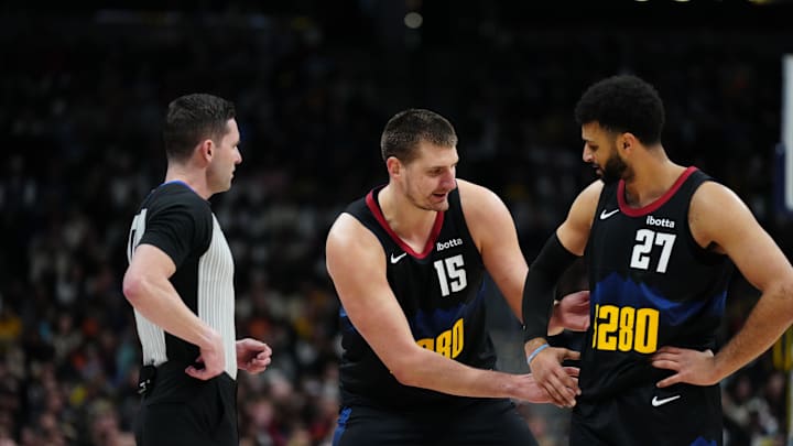 Jan 7, 2024; Denver, Colorado, USA; NBA referee Ben Taylor (46) listens to Denver Nuggets center Nikola Jokic (15)