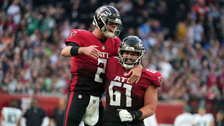 Oct 10, 2021; London, England, United Kingdom; Atlanta Falcons quarterback Matt Ryan (2) and center Matt Hennessy (61) celebrate after a touchdown in the fourth quarter against the New York Jets during an NFL International Series aame at Tottenham Hotspur Stadium. The Falcons defeated the Jets 27-20. Mandatory Credit: Kirby Lee-Imagn Images Oct 10, 2021; London, England, United Kingdom; Atlanta Falcons quarterback Matt Ryan (2) and center Matt Hennessy (61) celebrate after a touchdown in the fourth quarter against the New York Jets during an NFL International Series aame at Tottenham Hotspur Stadium. The Falcons defeated the Jets 27-20. Mandatory Credit: Kirby Lee-Imagn Images