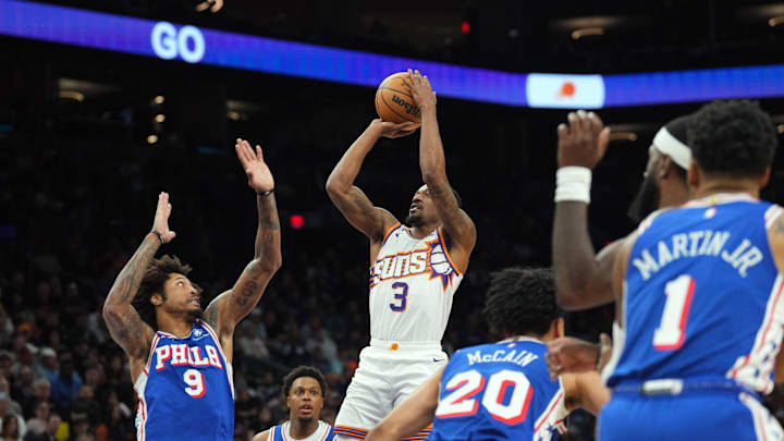 Nov 4, 2024; Phoenix, Arizona, USA; Phoenix Suns guard Bradley Beal (3) shoots over Philadelphia 76ers guard Kelly Oubre Jr. (9) during the first half at Footprint Center. Mandatory Credit: Joe Camporeale-Imagn Images