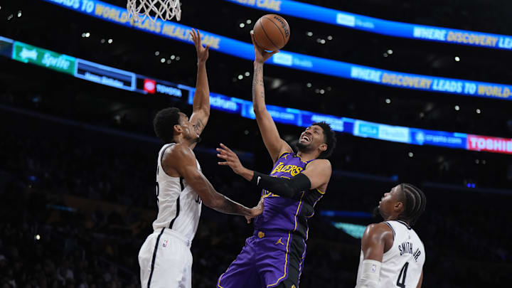 Jan 19, 2024; Los Angeles, California, USA; Los Angeles Lakers forward Christian Wood (35) shoots the ball against Brooklyn Nets forward Dorian Finney-Smith (28) and guard Dennis Smith Jr. (4) in the first half at Crypto.com Arena. Mandatory Credit: Kirby Lee-Imagn Images Jan 19, 2024; Los Angeles, California, USA; Los Angeles Lakers forward Christian Wood (35) shoots the ball against Brooklyn Nets forward Dorian Finney-Smith (28) and guard Dennis Smith Jr. (4) in the first half at Crypto.com Arena. Mandatory Credit: Kirby Lee-Imagn Images
