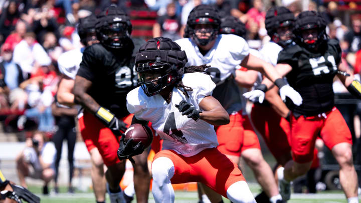 Cincinnati Bearcats wide receiver Tyrin Smith (4) runs the ball during the University of Cincinnati annual Red and Black Spring football game and practice at Nippert Stadium in Cincinnati on Saturday, April 13, 2024.