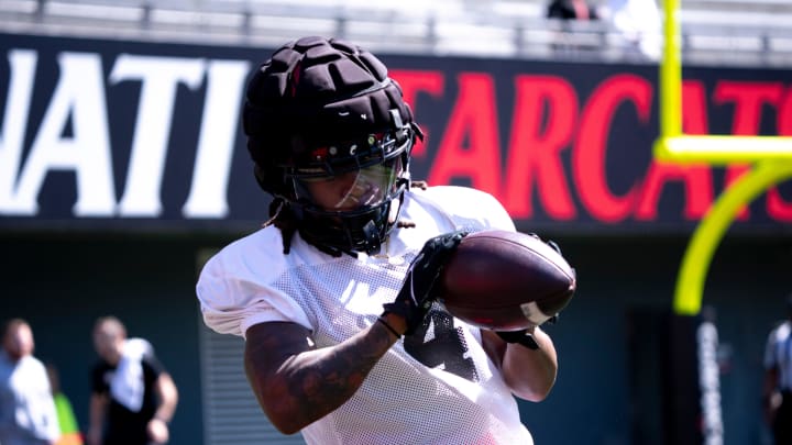Cincinnati Bearcats wide receiver Tyrin Smith (4) catches a pass during the University of Cincinnati annual Red and Black Spring football game and practice at Nippert Stadium in Cincinnati on Saturday, April 13, 2024. Cincinnati Bearcats wide receiver Tyrin Smith (4) catches a pass during the University of Cincinnati annual Red and Black Spring football game and practice at Nippert Stadium in Cincinnati on Saturday, April 13, 2024.