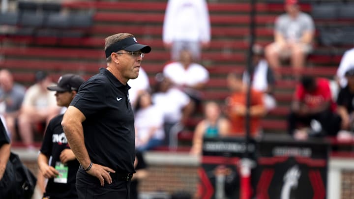 Cincinnati Bearcats head coach Scott Satterfield looks on in before the College Football game between the Cincinnati Bearcats and the Towson Tigers at Nippert Stadium in Cincinnati on Saturday, Aug. 31, 2024. Cincinnati Bearcats head coach Scott Satterfield looks on in before the College Football game between the Cincinnati Bearcats and the Towson Tigers at Nippert Stadium in Cincinnati on Saturday, Aug. 31, 2024.